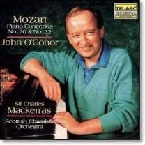 Album cover with John O’Conor at a piano; features Mozart Piano Concertos Nos. 20 & 22.