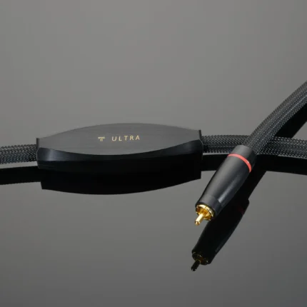 Close-up of a braided audio cable with a gray metal housing that says ULTRA.