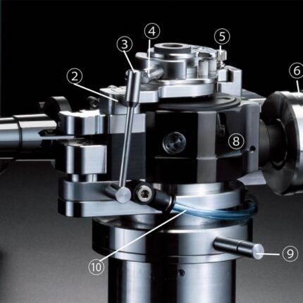 Close-up of a precision machine spindle with numbered callouts (1–10) marking adjustment levers, clamps, and knobs.