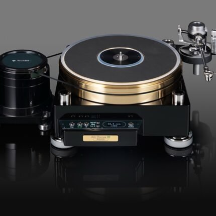 Premium turntable with gold-plated platter, black base, and adjustable tonearm on the right, sitting on a reflective surface.